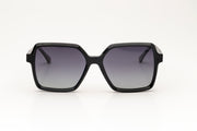 Sunglasses with black acetate frame with gradient lenses, on a white background.