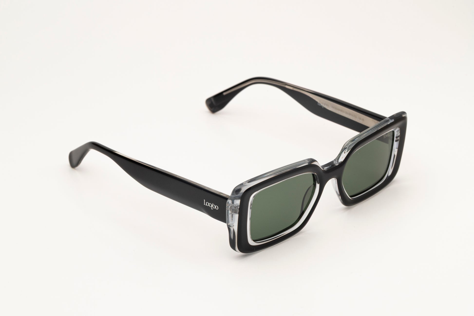 Sunglasses with black and crystal acetate frame on a white background.