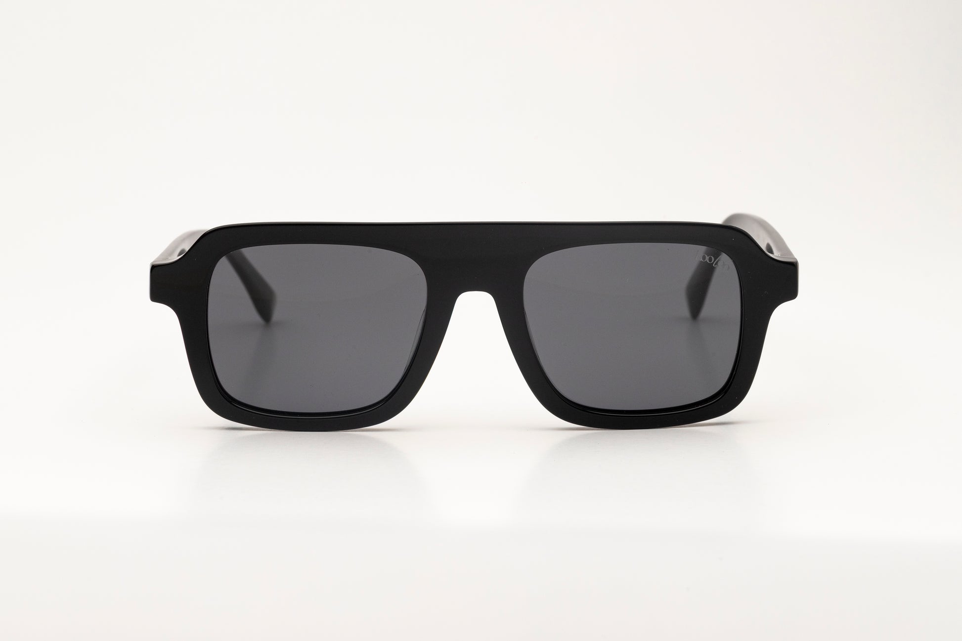 Sunglasses with black acetate frame on a white background.
