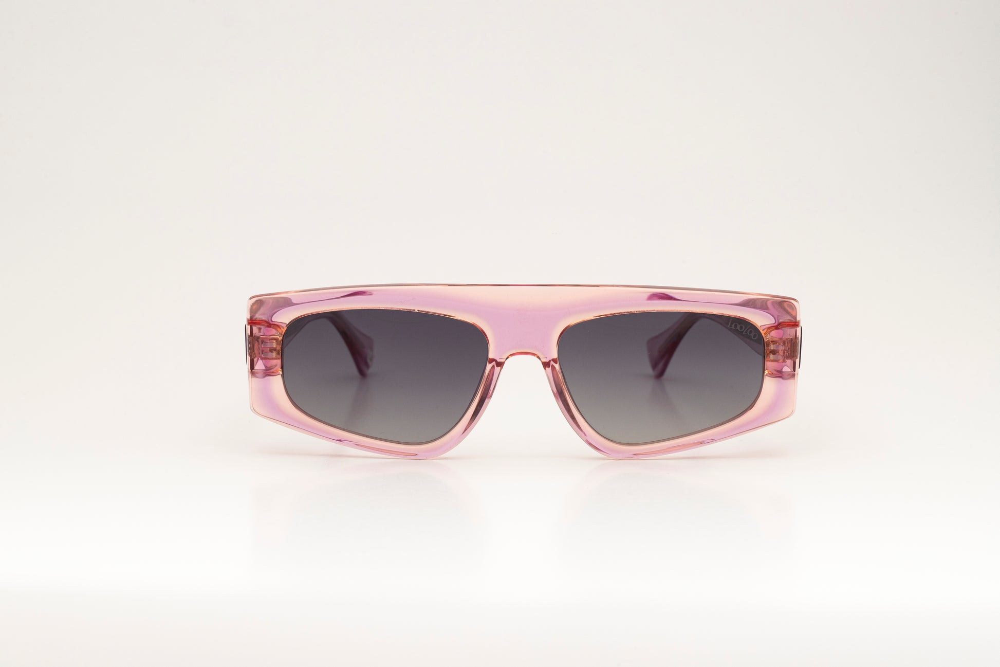 Sunglasses with pink acetate frame on a white background