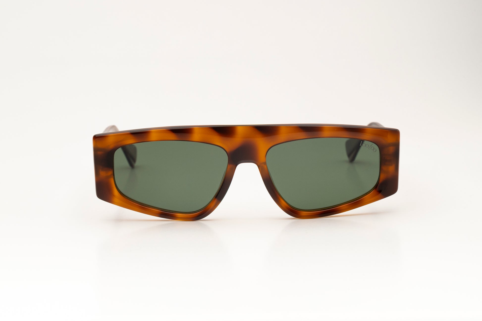 Sunglasses with tortoise acetate frame on a white background