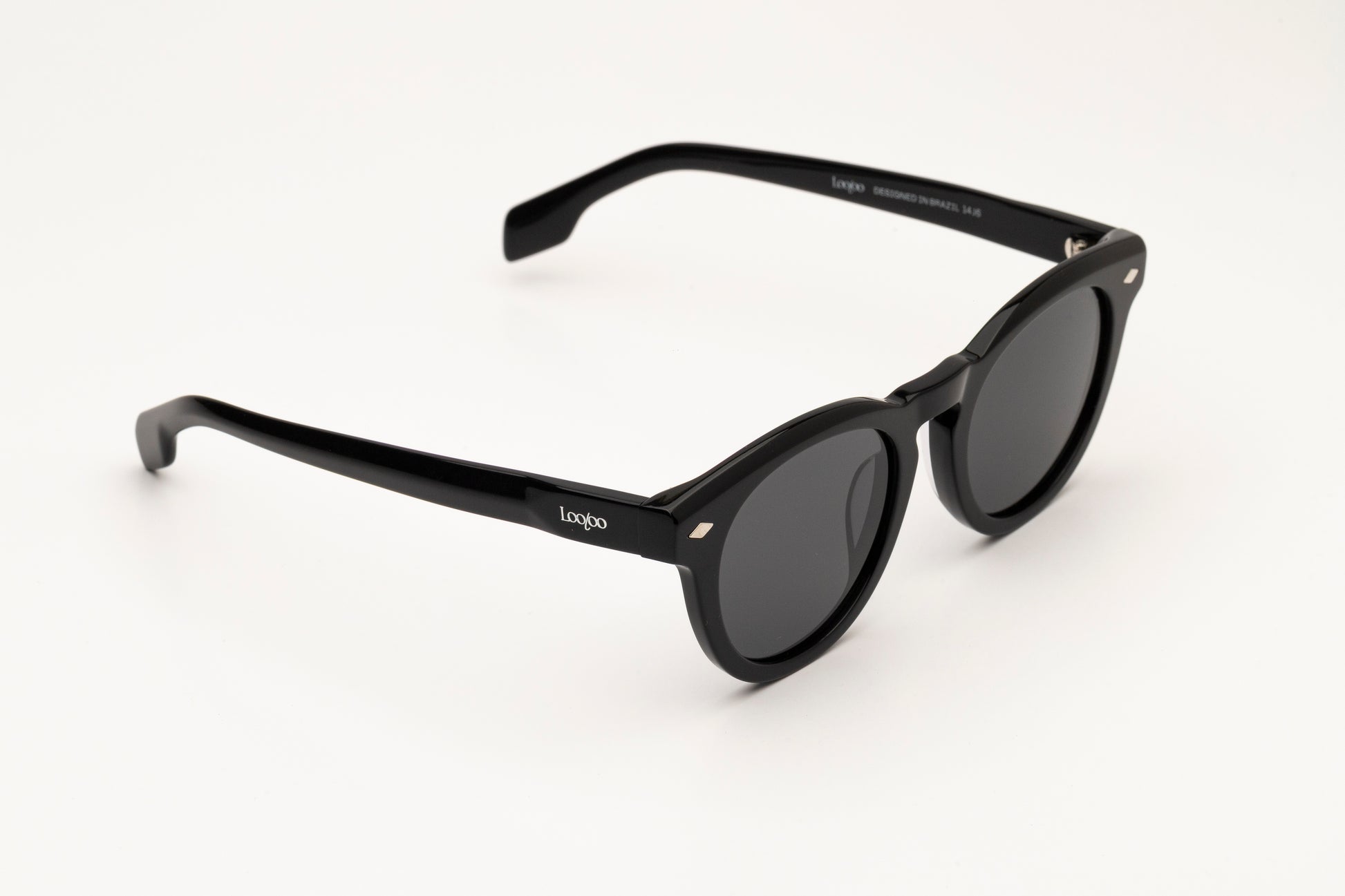 Sunglasses with black acetate frame  on a white background.