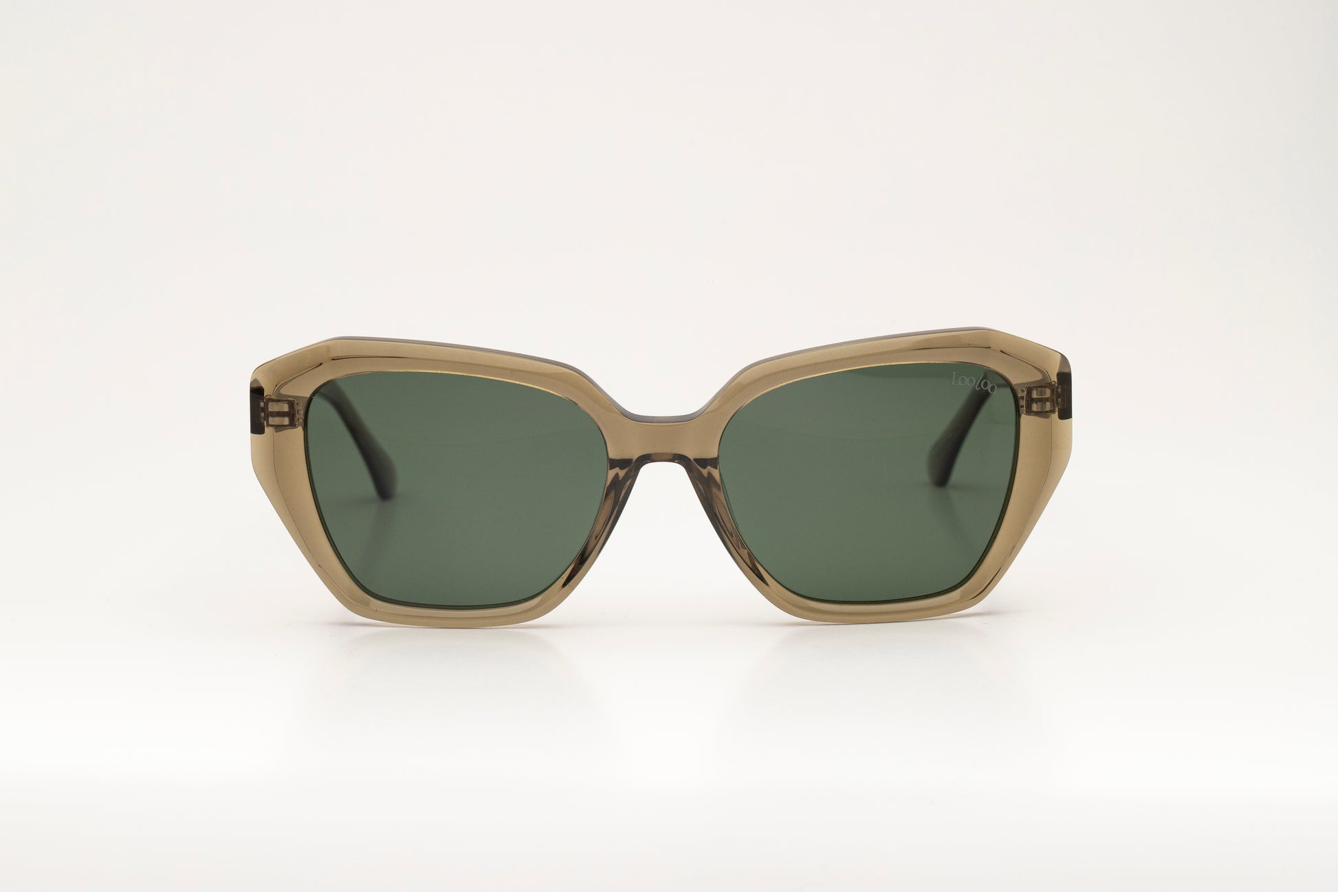 Sunglasses with green acetate frame and green lenses on a white background