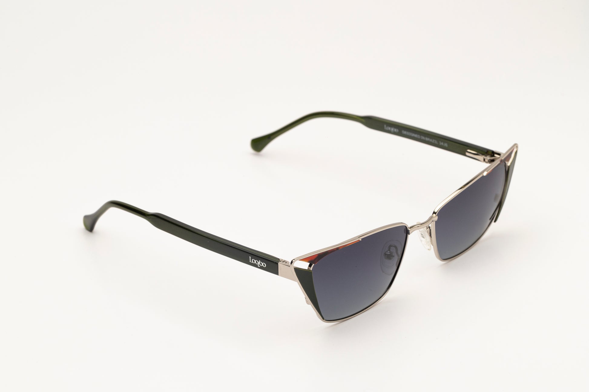 Sunglasses with black acetate and metal frame, on a white background.